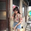 shortsleeved button down blouse with floral print