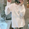 european station 2024 spring cuff shirt splicing loose mid length white t shirt layered with a base layer