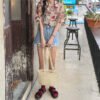 shortsleeved button down blouse with floral print