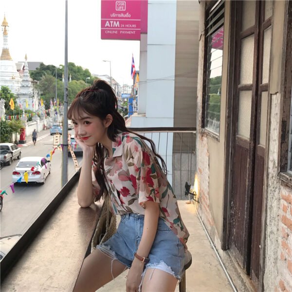 shortsleeved button down blouse with floral print