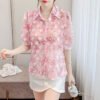 floral blouse with three dimensional decoration
