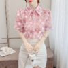 floral blouse with three dimensional decoration