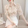 floral blouse with three dimensional decoration