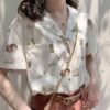collared blouse with short sleeves and angel print